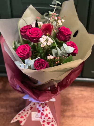 Six of our finest - Six of our finest romantic roses. Mixed with wax flower and seasonal foliages. Red roses are pre ordered in other than peak times so please remember this when ordering.